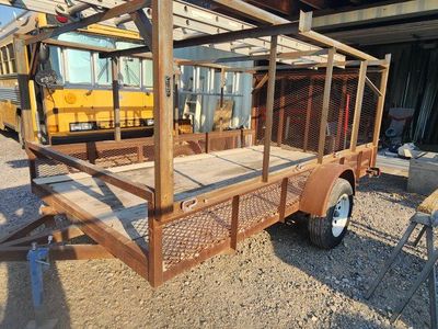 Single-Axle Utility Trailer with Built-in Ladder Rack and Wood Deck