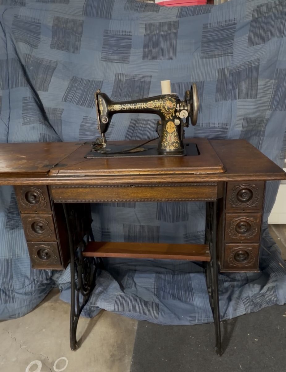 Antique Singer Electric Sewing Machine with Ornate Cabinet and Iron Stand