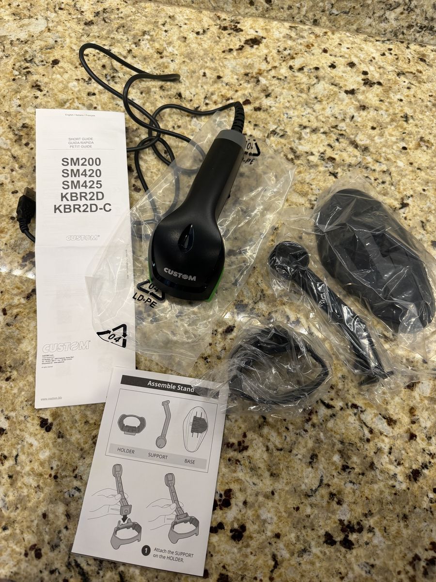2D barcode scanner with a hands-free stand