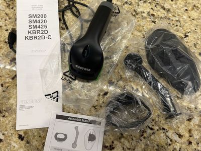 2D barcode scanner with a hands-free stand