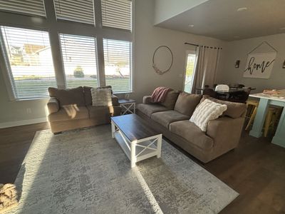 Tan sofa and loveseat