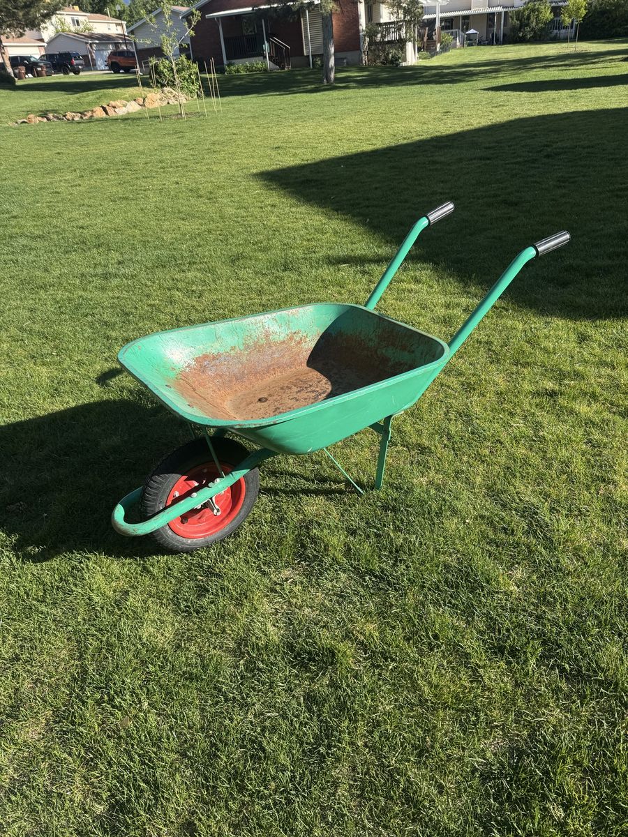 Green Steel Wheelbarrow with Red Wheel