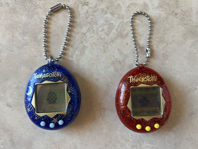 2 Tamagotchi Digital Pets- Blue Starry Shower and Red Glitter