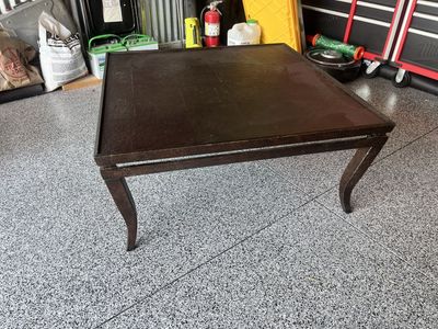 Brown/Bronzed coffee table. 40” X 40”. Very sturdy , great shape.