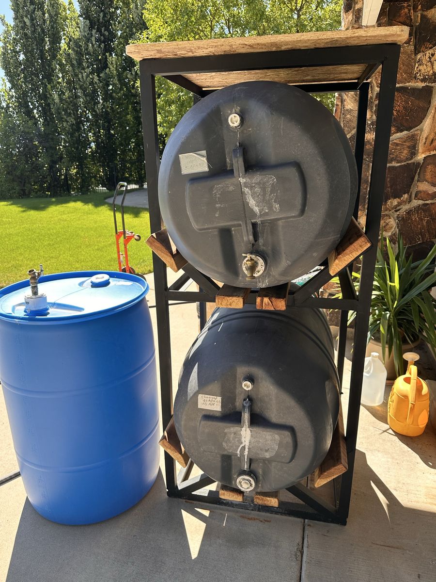 55 Gallon water barrels and stand