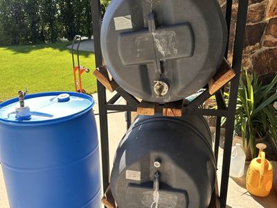 55 Gallon water barrels and stand