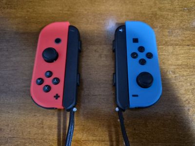 Nintendo Joy-Con Video Game Controllers with Straps for Nintendo Switch, Neon Blue/Red (HAC-015/16)