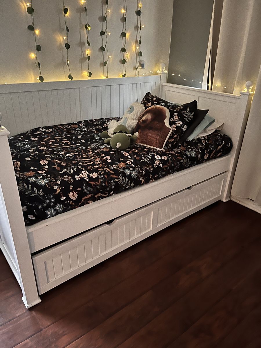 Twin day bed with twin bed trundle.