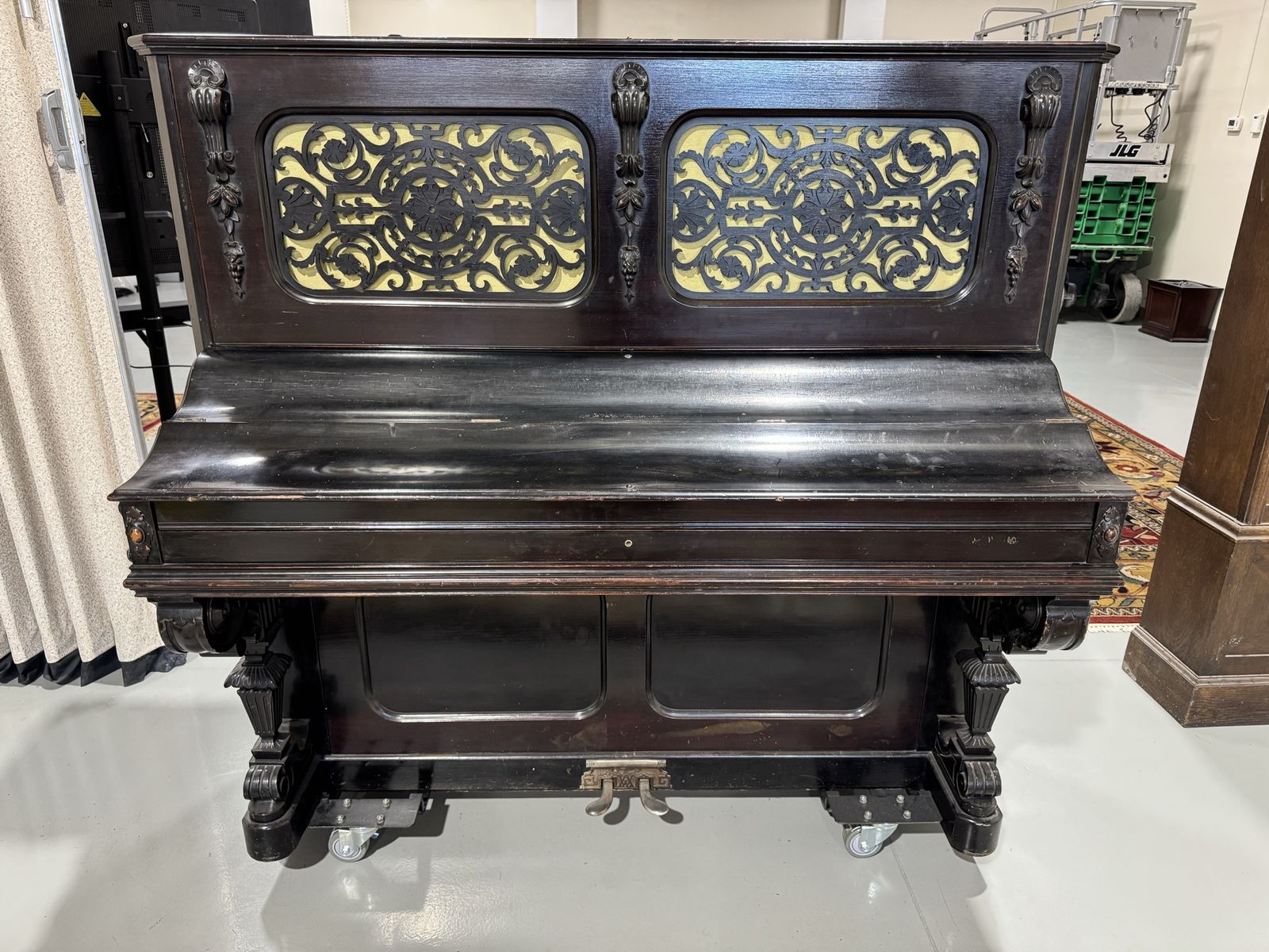 Classic Dark Wood Upright Piano with Carved Details and Pedals - Vintage Musical Instrument