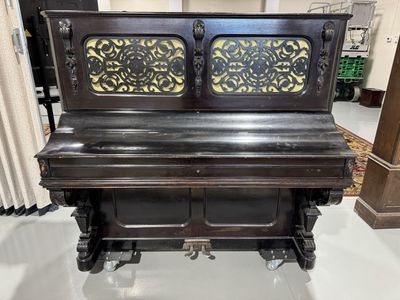 Classic Dark Wood Upright Piano with Carved Details and Pedals - Vintage Musical Instrument