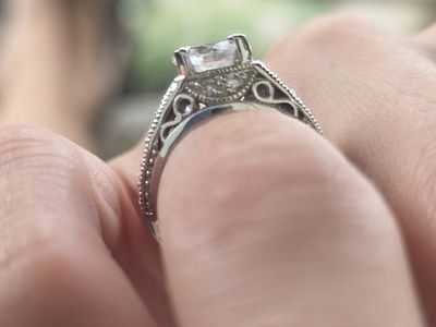 Elegant Silver-Toned Statement Ring with Large Round Center Stone and Intricate Band Design