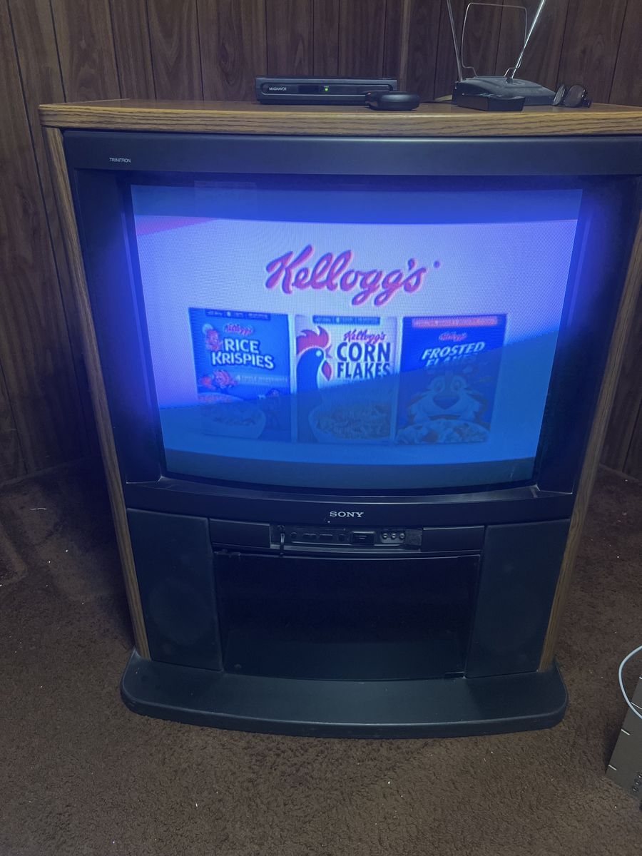 Vintage Sony TV in solid oak cabinet