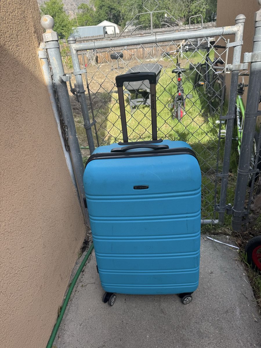 Rockland blue hard sheel luggage 29” Tall