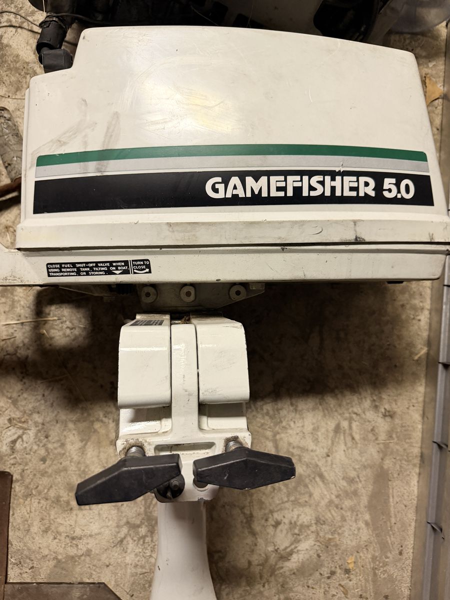 Small outboard motor for raft or small boat.