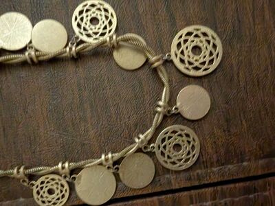 vintage Ladies necklace with 11 charms on it