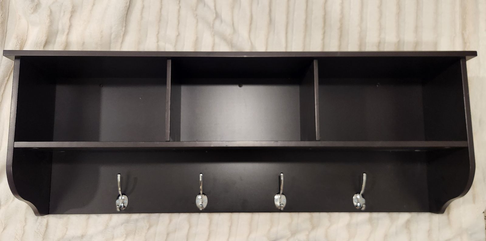 Brown wood shelf and coat hanger