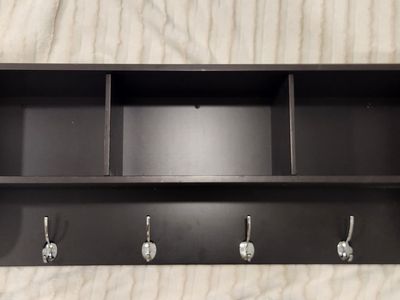Brown wood shelf and coat hanger