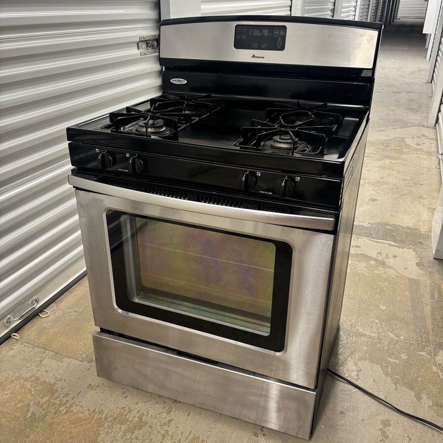 Amana Stainless Steel Gas Range with Black Cooktop, Freestanding.   clean and works great!
