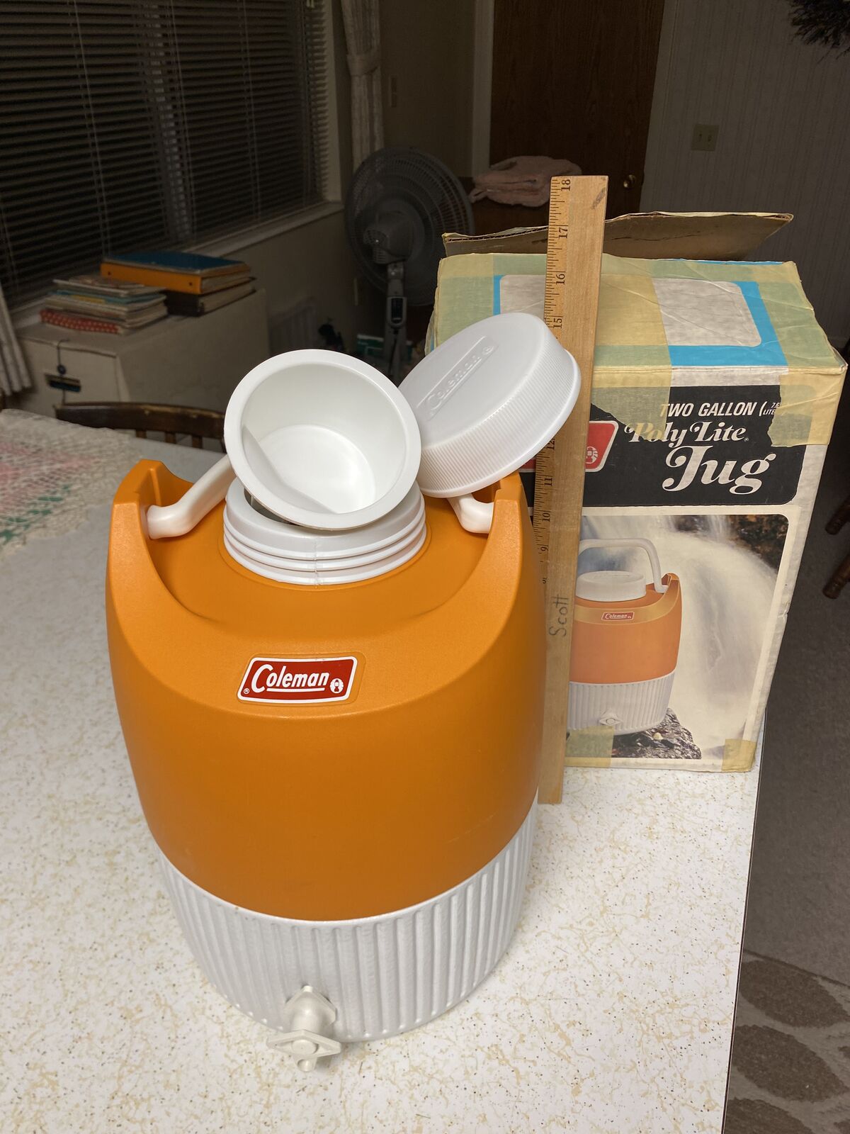 Orange Coleman 2 gallon poly lite jug with box