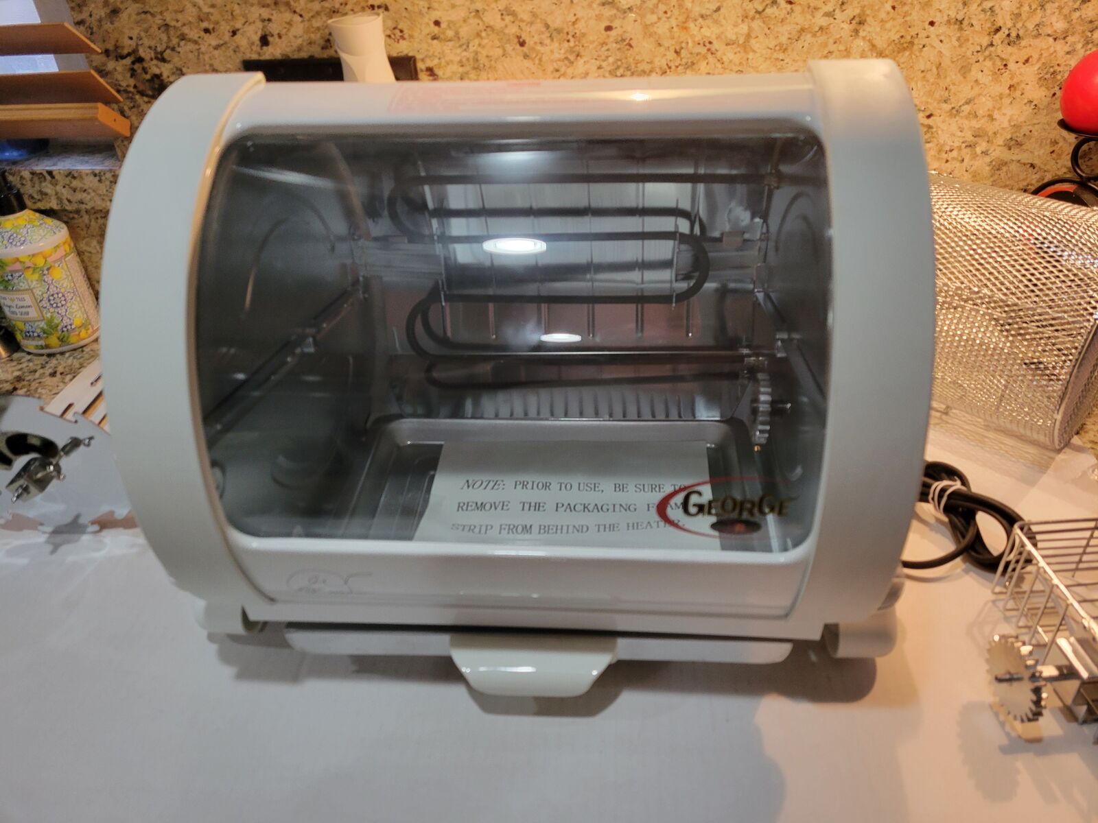 George Foreman Jr. Large Rotisserie. New and Unused with all Attachments