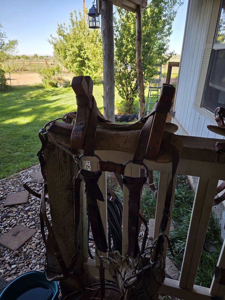 One custom made pack saddle with rear britchen strap and newer latigos