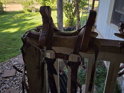 One custom made pack saddle with rear britchen strap and newer latigos