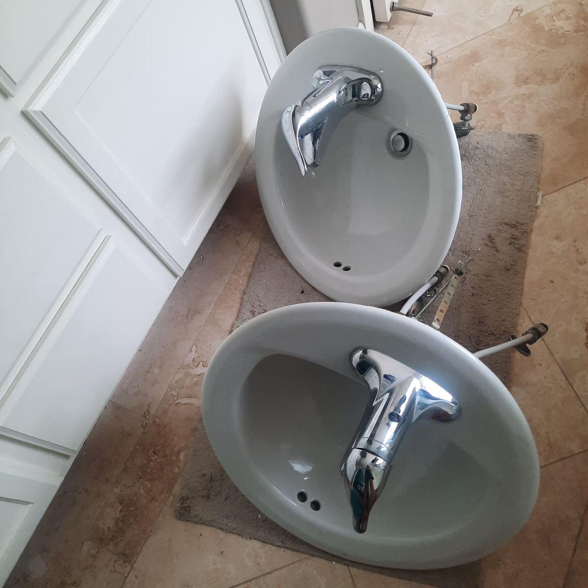 2 White Oval Ceramic Sinks with Moen Chrome Faucets - Used