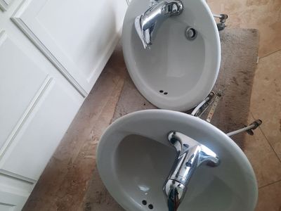 2 White Oval Ceramic Sinks with Moen Chrome Faucets - Used