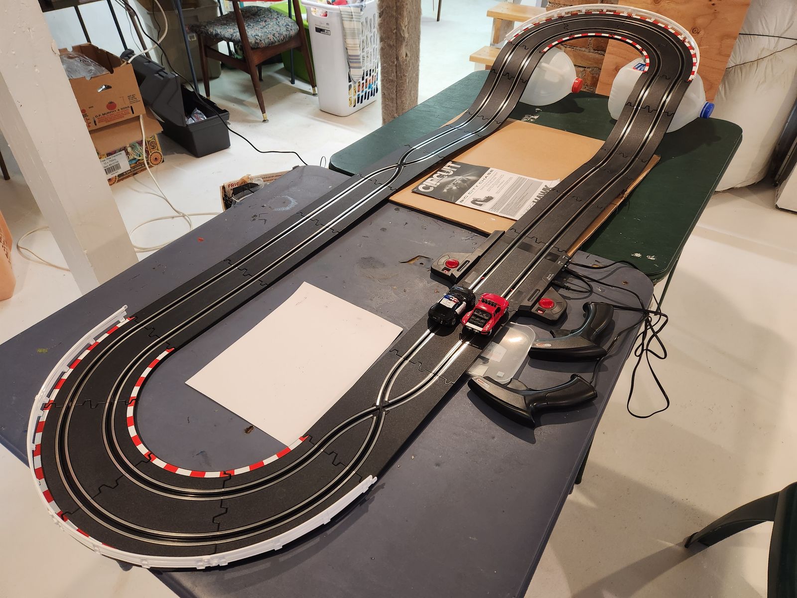 Electric Slot Car race track set. 1 to 43 scale.  Works great.  Cars are super nice.