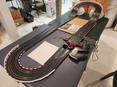 Electric Slot Car race track set. 1 to 43 scale. Works great. Cars are super nice.