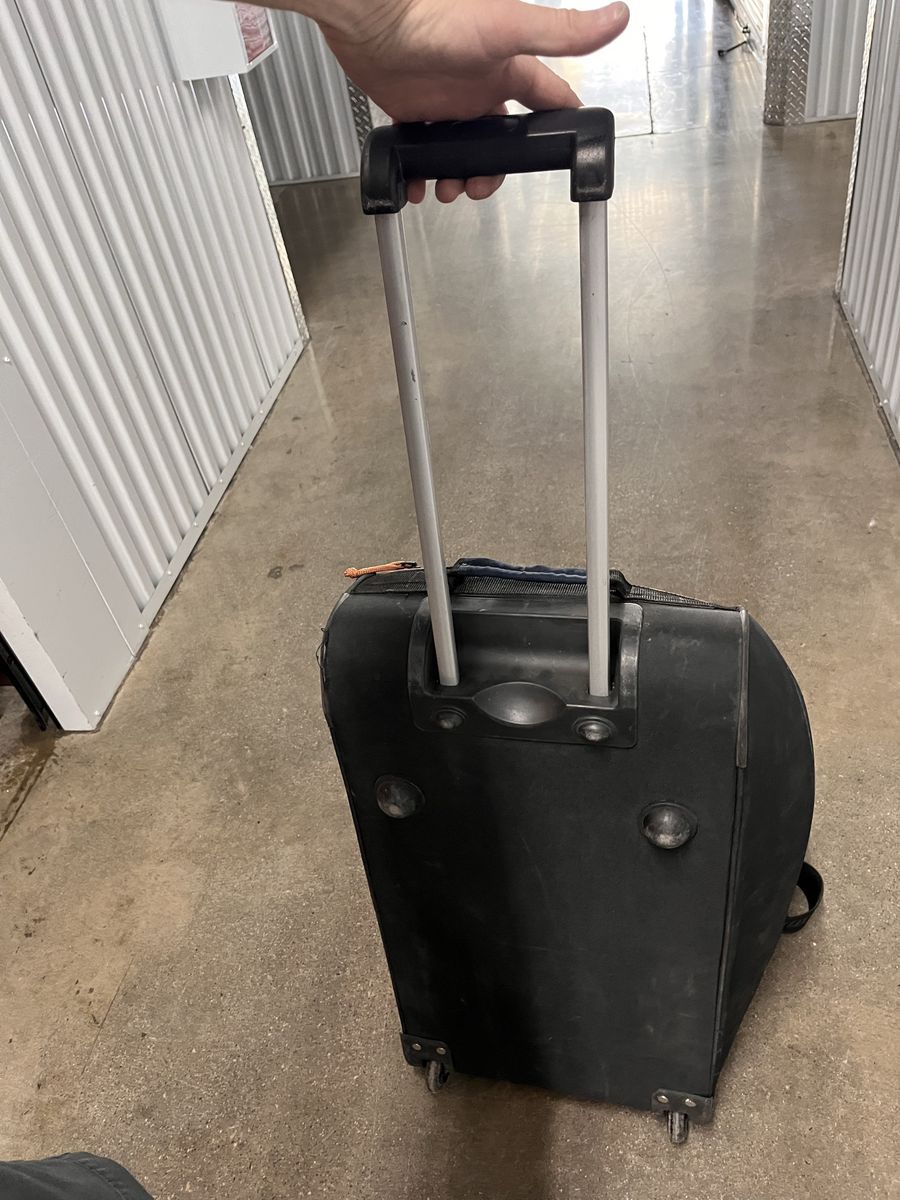 Used Black Rolling Duffle Bag with Extendable Handle