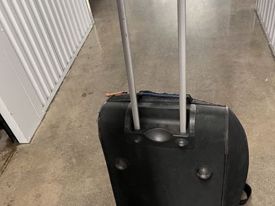 Used Black Rolling Duffle Bag with Extendable Handle
