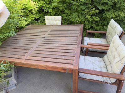 IKEA wooden table and 3 chairs outside