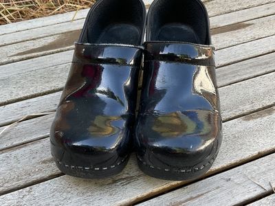 black glossy clogs