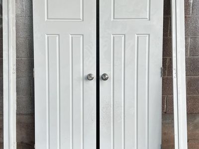 White Paneled Bifold Closet Doors with Hardware - Used