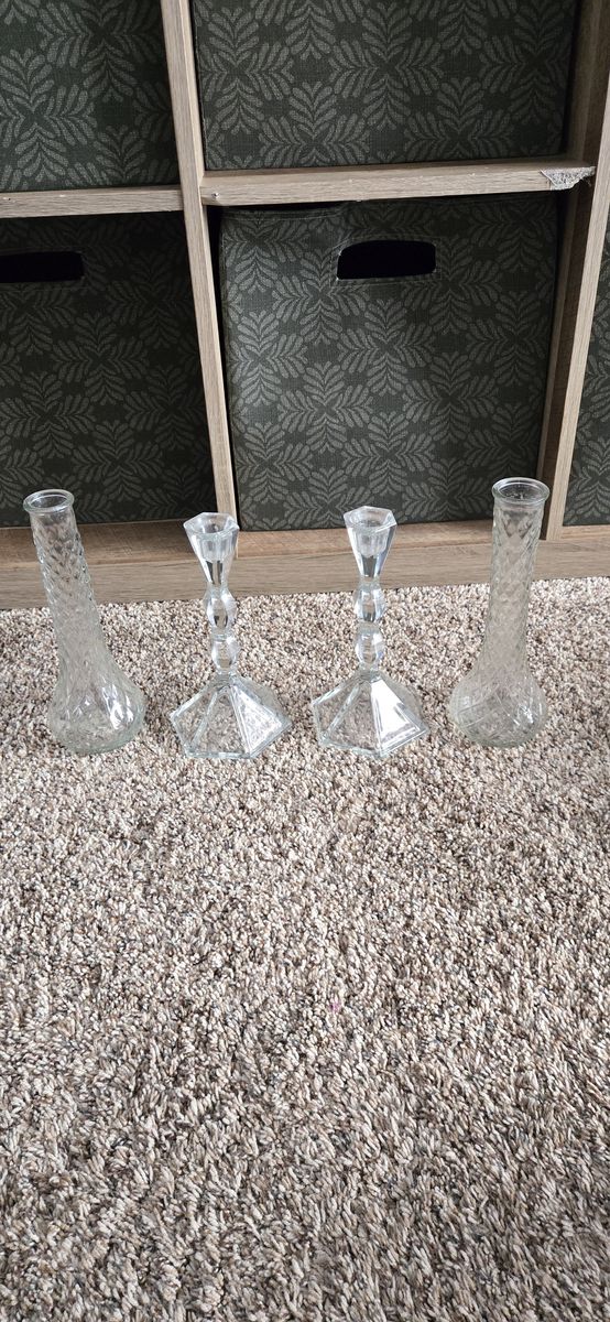 2 thin glass vases, and 2 glass candle stick holders 