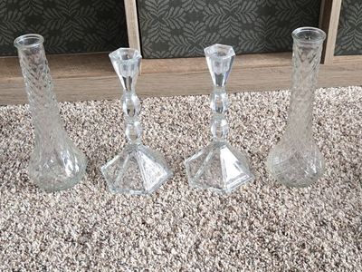 2 thin glass vases, and 2 glass candle stick holders
