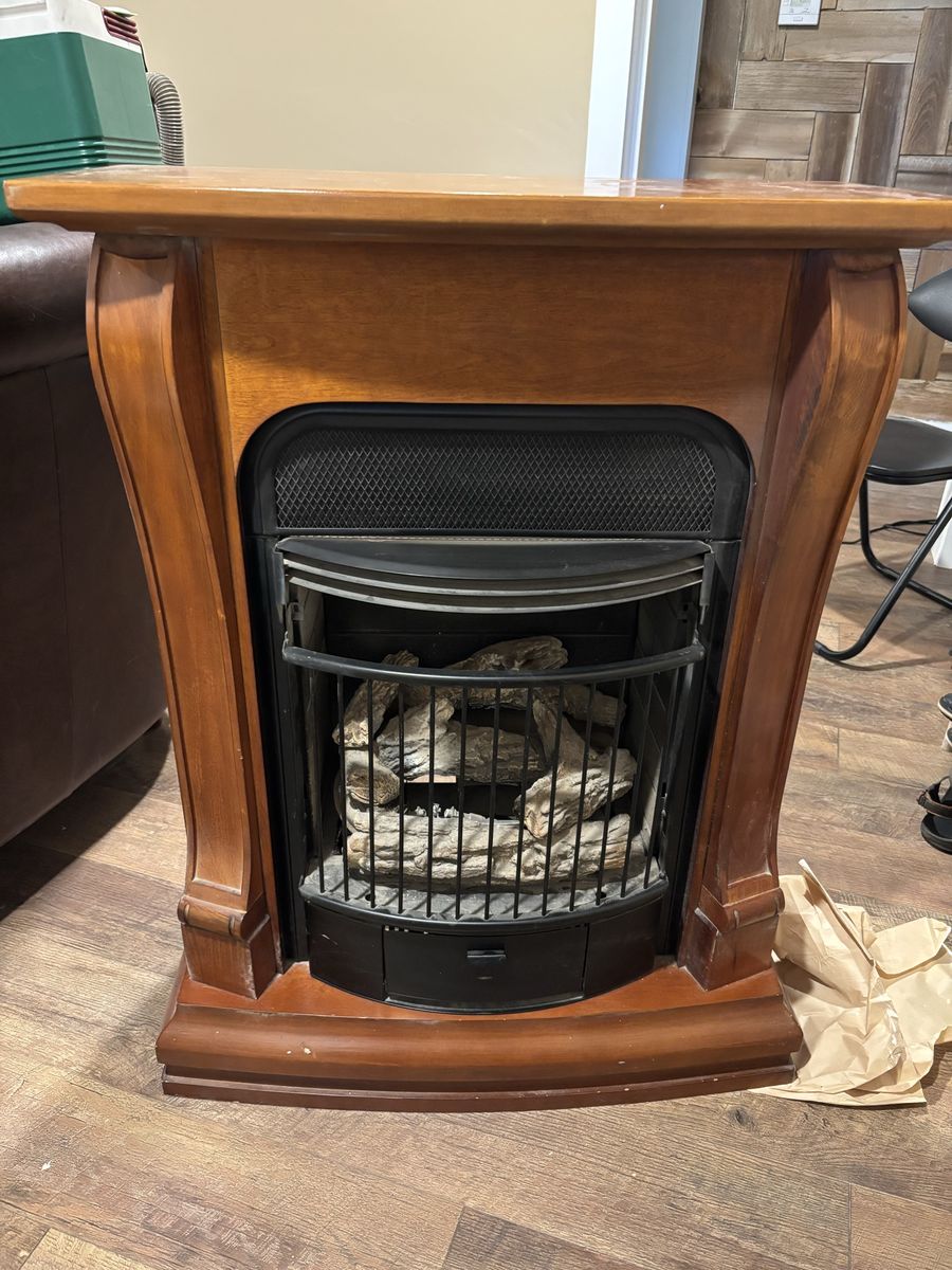 Indoor Gas Fireplace with Wood Mantel Cabinet and Faux Logs