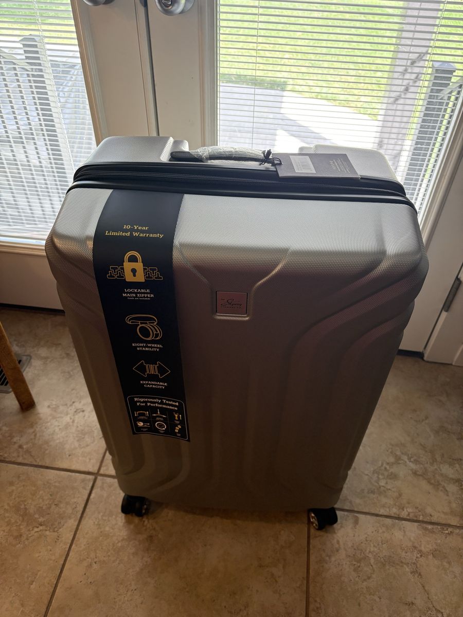 The Skyway Luggage Co. Hard-Sided Expandable Spinner Suitcase Silver