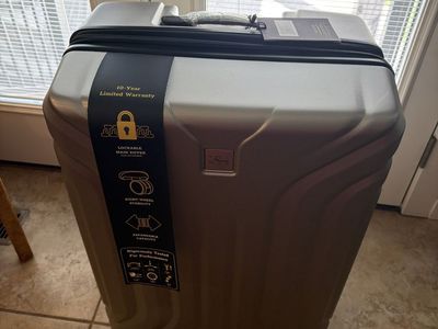 The Skyway Luggage Co. Hard-Sided Expandable Spinner Suitcase Silver