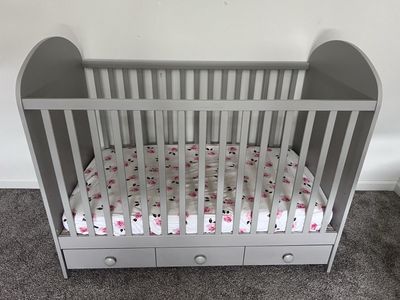 Modern IKEA crib with storage drawers