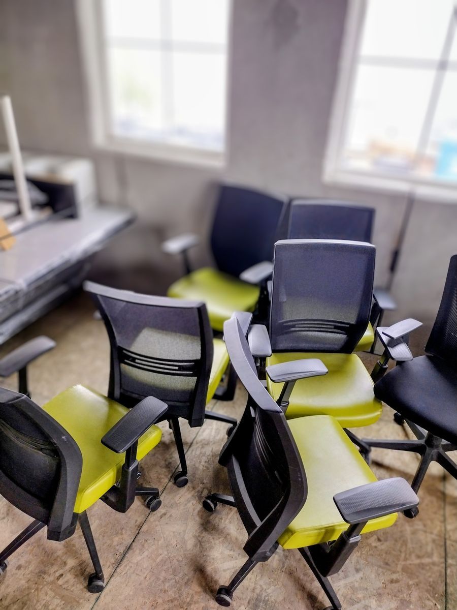 Green and black office chairs