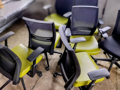 Green and black office chairs
