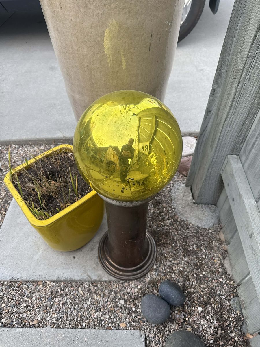 Glass Yard Orbs on Concrete Pedestals – Blue & Amber Set