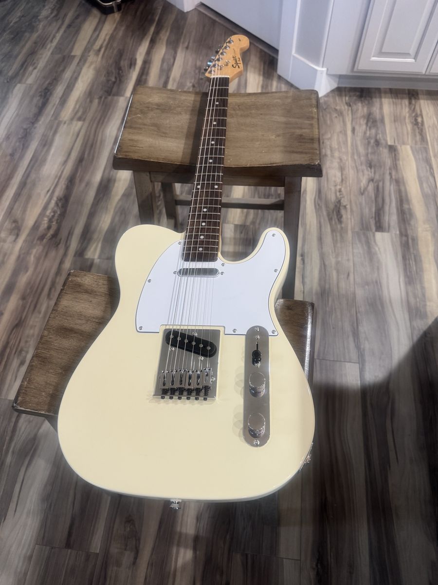 Like new Squier by Fender. Electric Guitar Telecaster Style Cream Body White Pick Guard 