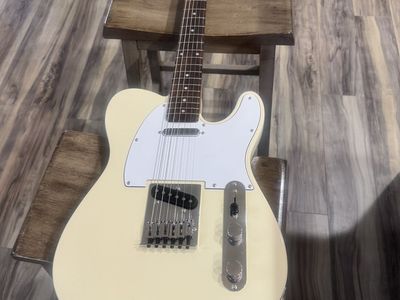Like new Squier by Fender. Electric Guitar Telecaster Style Cream Body White Pick Guard