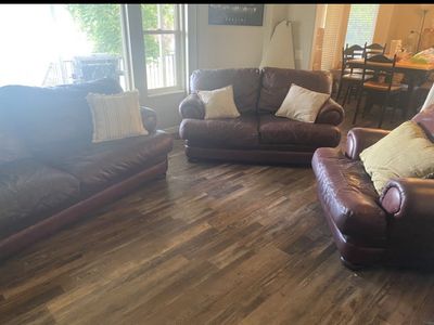 Burgundy Leather Sofa ottoman with Torn Cushion Seam Needs Repair