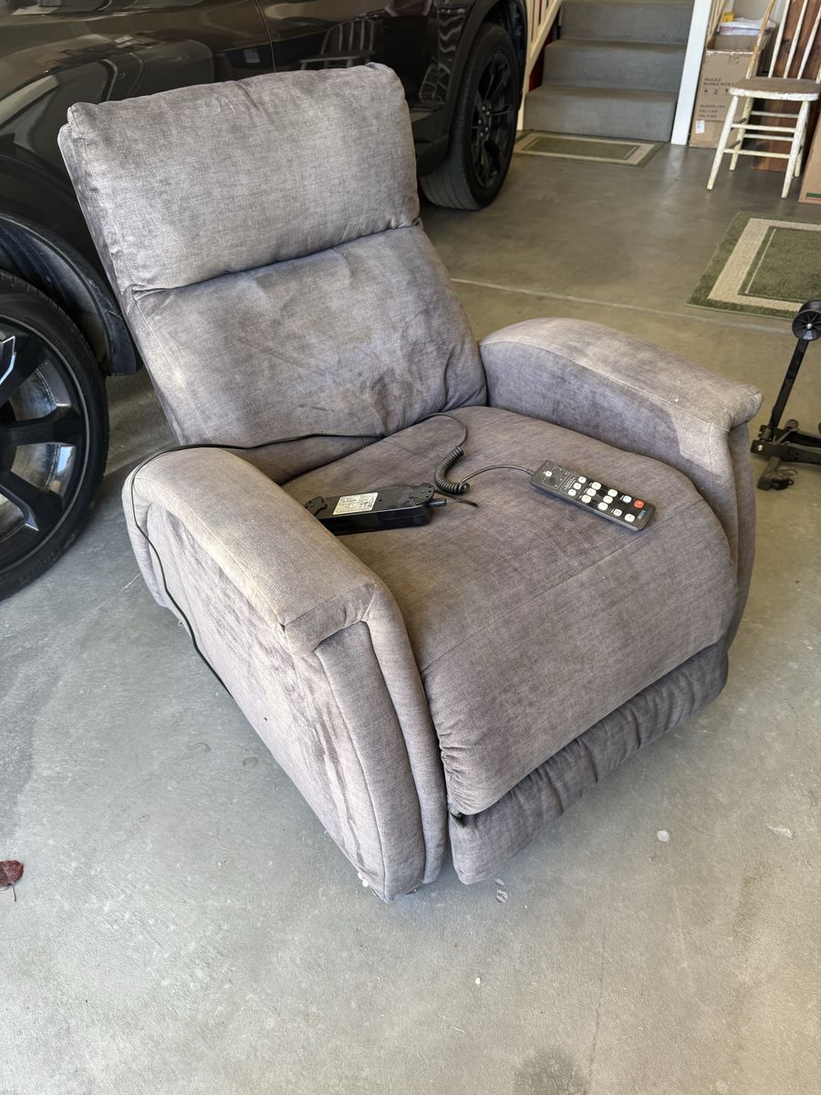 Zero gravity recliner w/ adjustable headrest, messages, and heater.