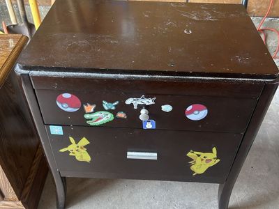 Dark Wood Two-Drawer Nightstand with Pikachu and Pokémon Stickers