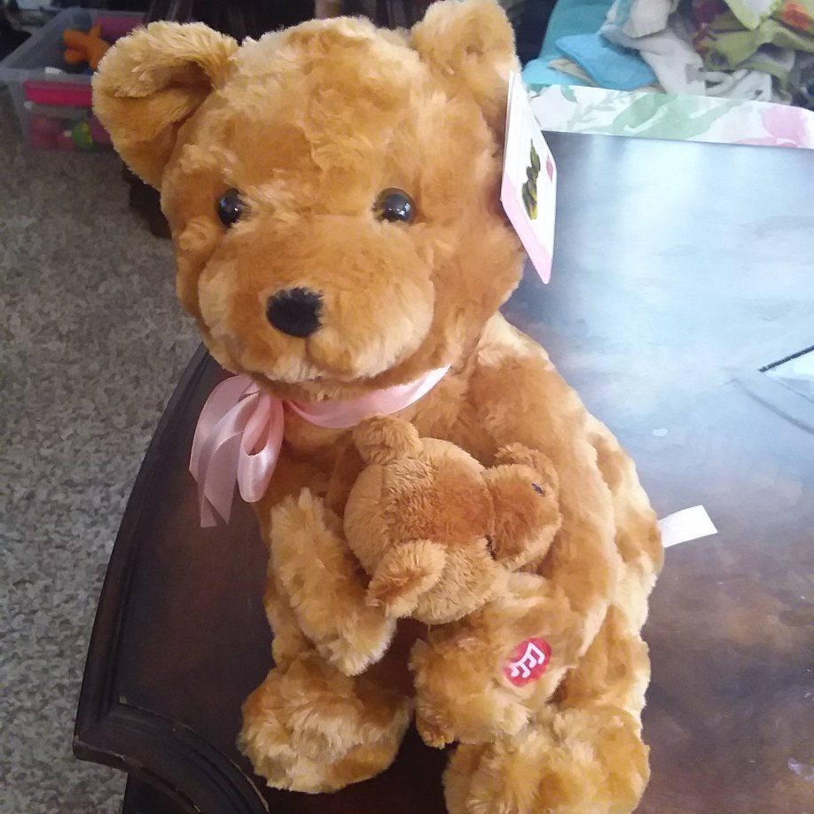 MAMA BEAR SINGS LULLABY AND PATS BABY'S BACK